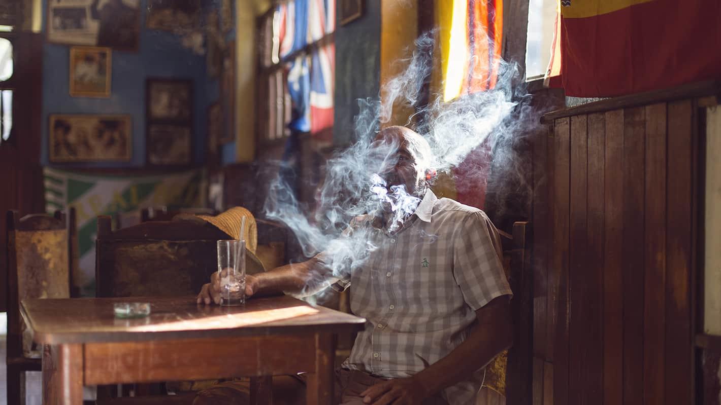 Cigar smoke covering man in havana